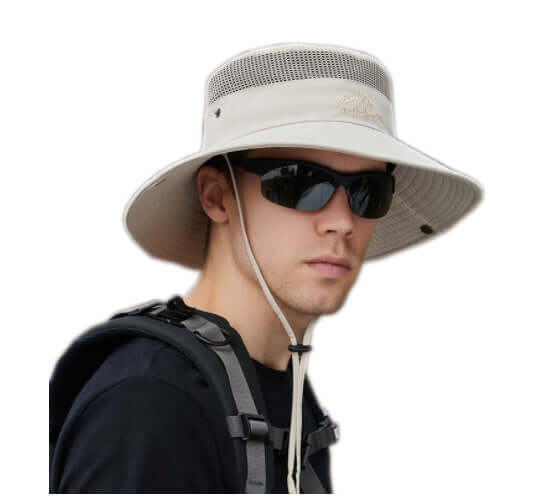 Man wearing a big brim sun hat outdoor protection with mesh detail and sunglasses.